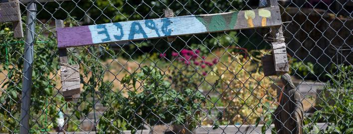 community garden sign reads "space"